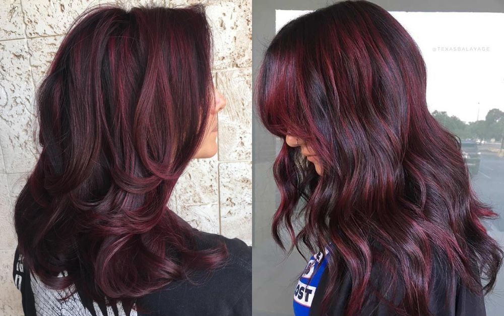 Elegant woman with straight black hair and subtle red highlights in natural lighting