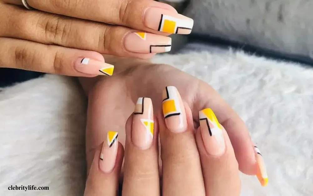 Top 10 Stunning Nail Design Ideas for Every Occasion 7 Two Stylish Geometric Nail Design with Bold Patterns