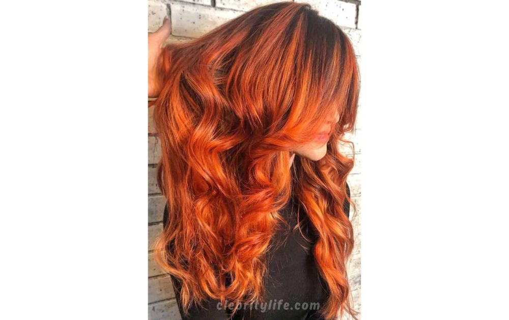 Deep Orange Curls with Shadow Roots hair look